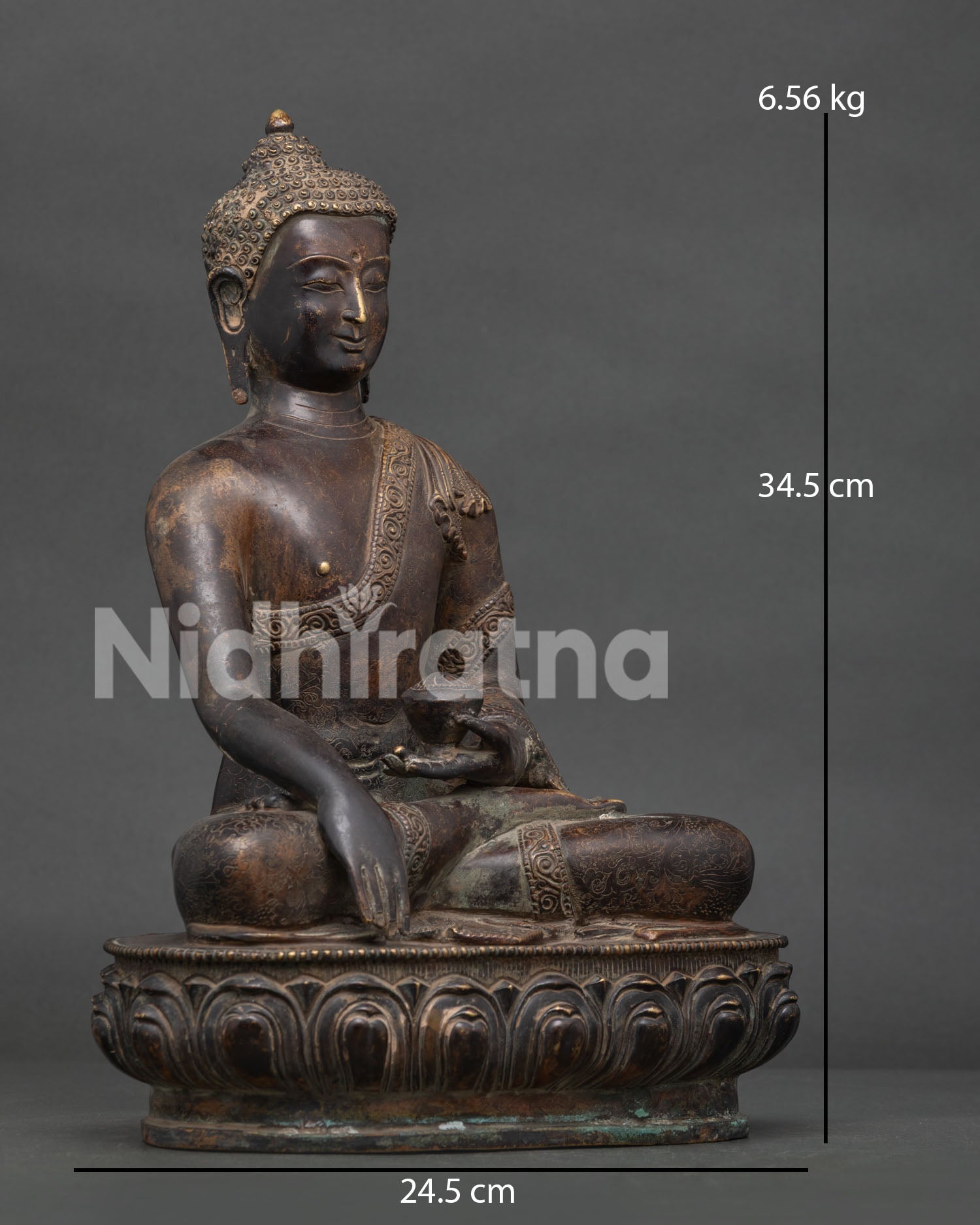 Shakyamuni Buddha statue seated on lotus pedestal in earth touching gesture.
