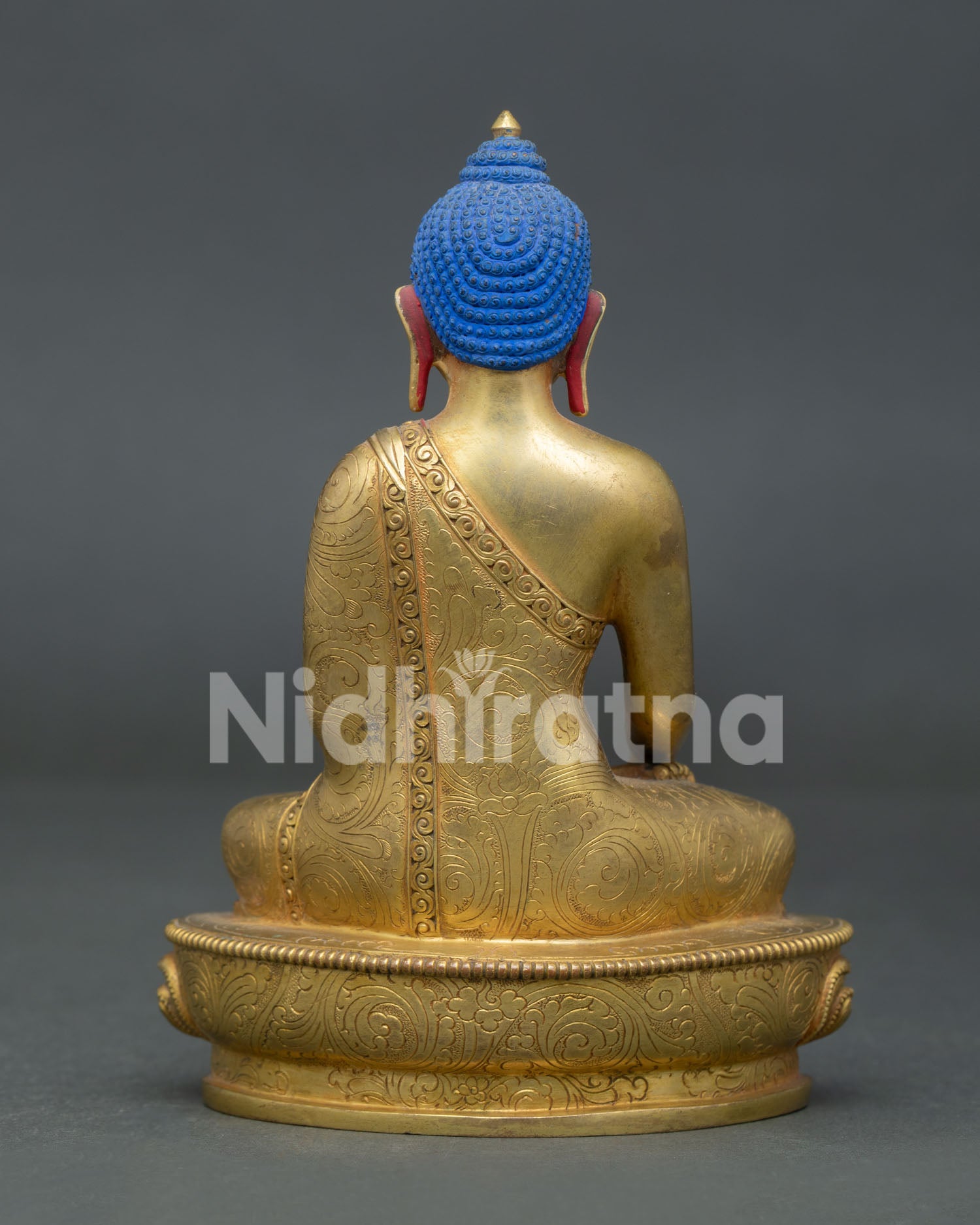 Shakyamuni Buddha statue showcasing traditional copper craftsmanship and flowing robes