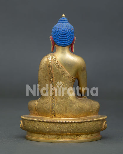 Shakyamuni Buddha statue showcasing traditional copper craftsmanship and flowing robes