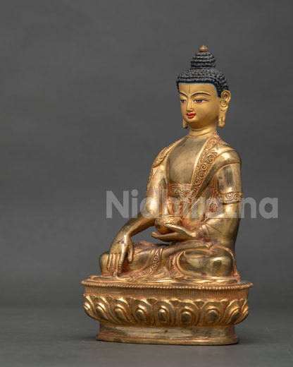 Shakyamuni Buddha statue showing alms bowl and Bhumisparsha earth-touching mudra.