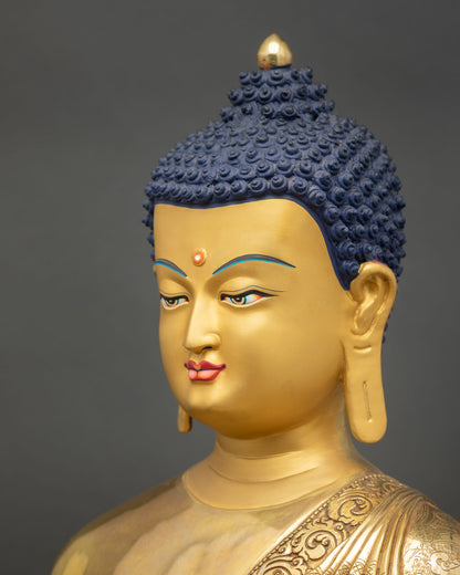 Side face close up Shakyamuni Buddha statue, refined gold gilded features with sacred Buddhist artistic detail
