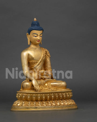Shakyamuni Buddha statue side view gold fire gilded copper.