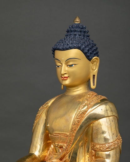 Shakyamuni Buddha statue upper body view with engraved robe borders in fire-gilded copper