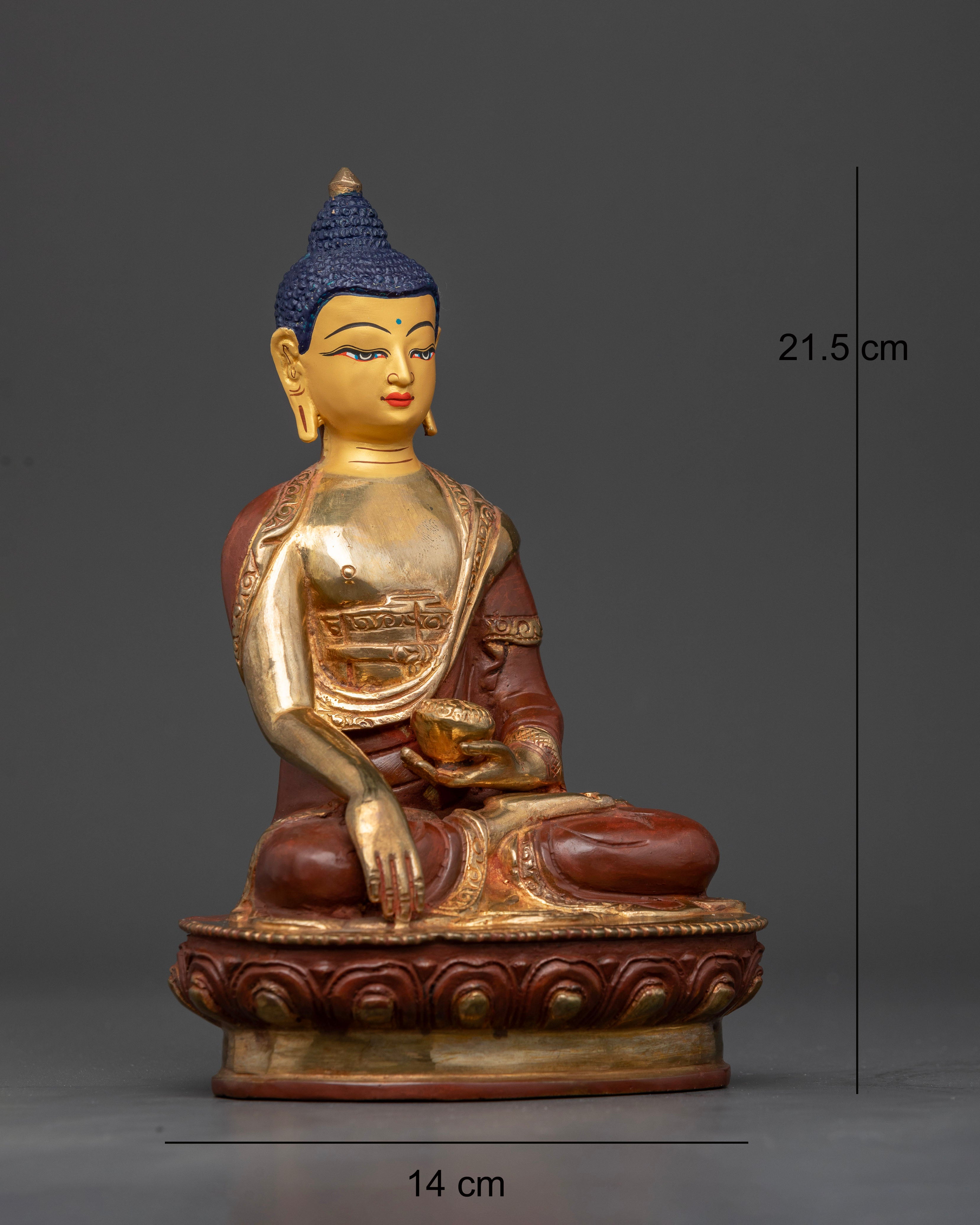 Shakyamuni buddha statue with blue eyes and oxidized monk robe.