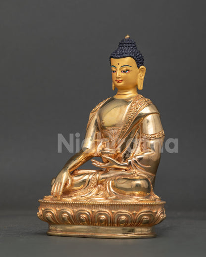 Shakyamuni buddha statue with delicate robe patterns and traditional carved motifs.