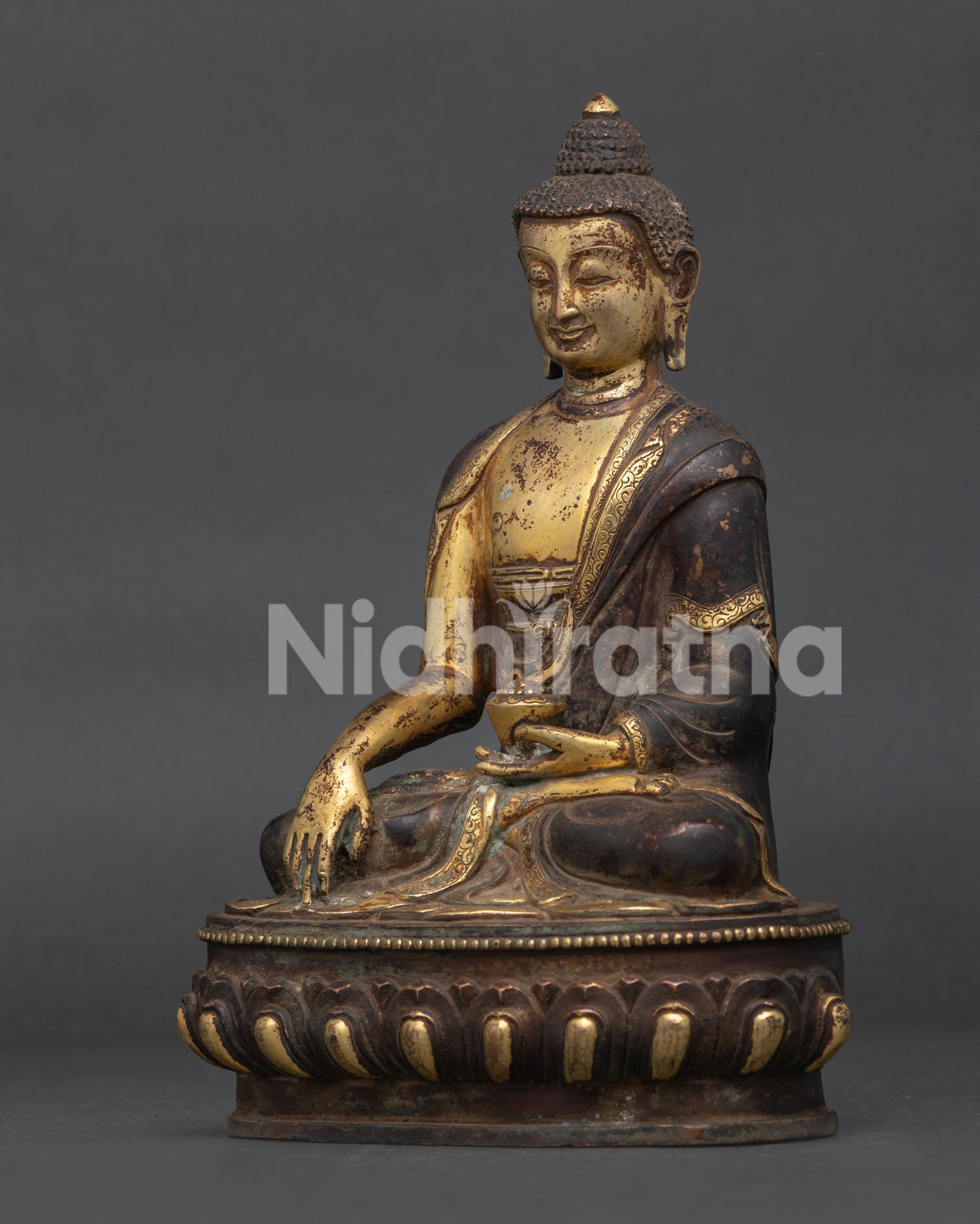 Shakyamuni Buddha statue with hand carved monk robe and begging bowl.
