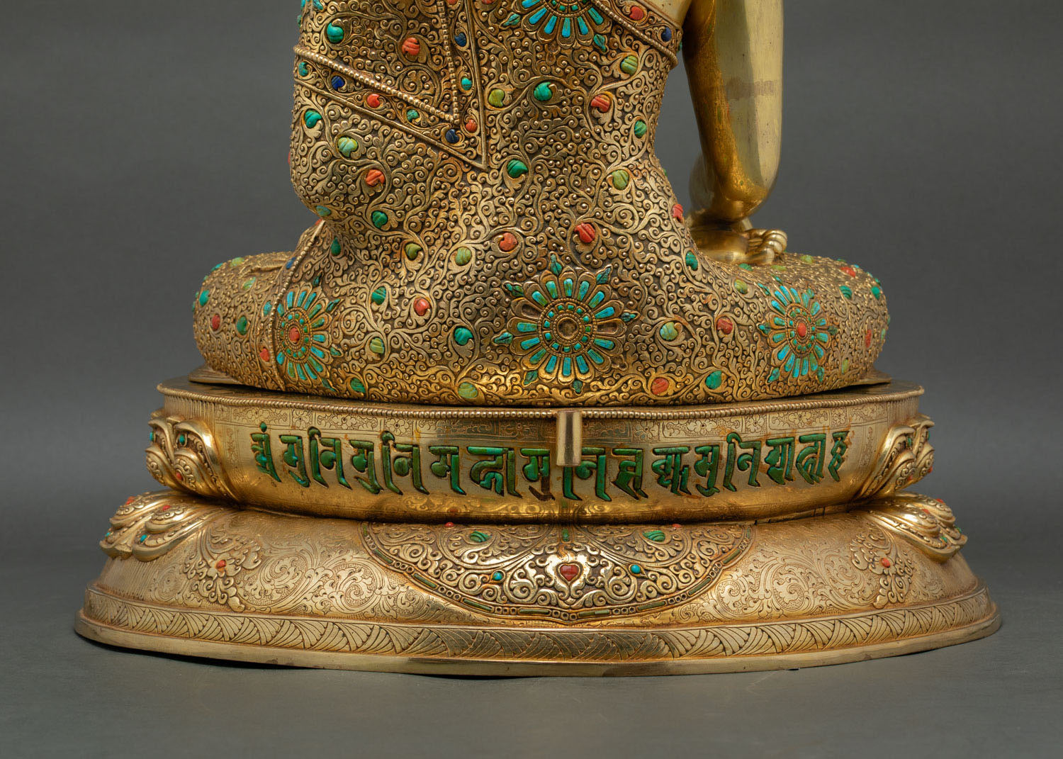 Shakyamuni mantra carved along the back of the lotus throne base