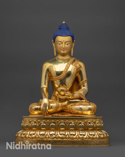 Front view of Shakyamuni Buddha statue with serene face and gold-gilded features