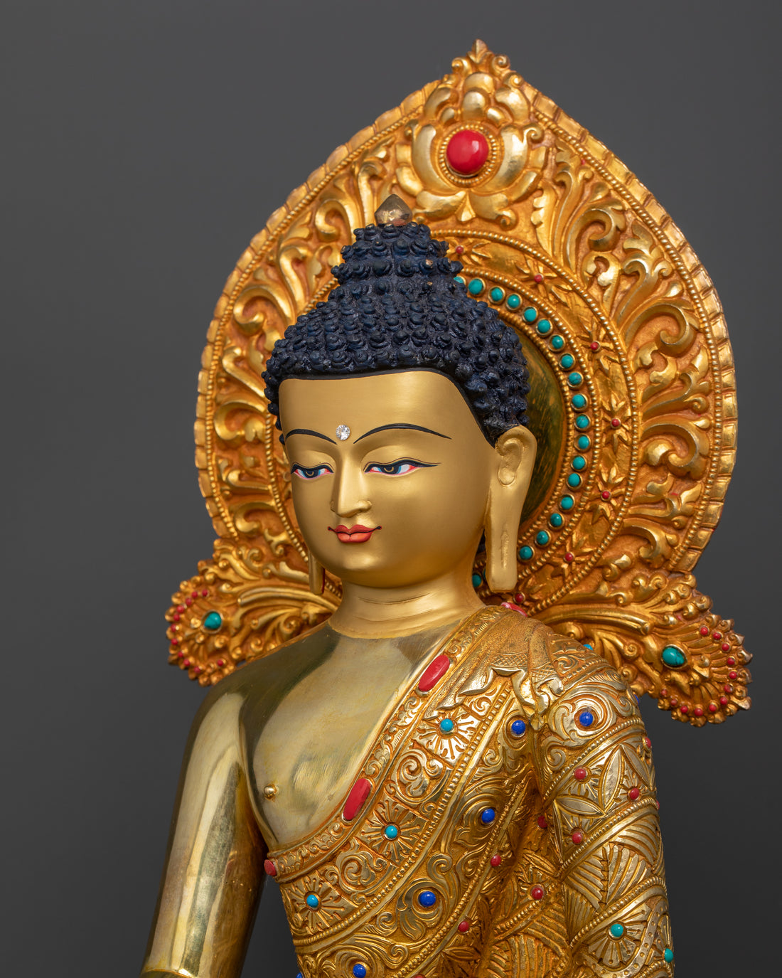 the 24 karat pure gold plated face of shakyamuni buddha