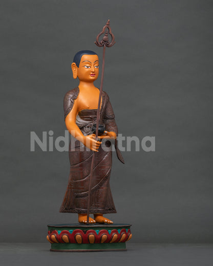Shariputra copper statue right side view, alms bowl and staff detail