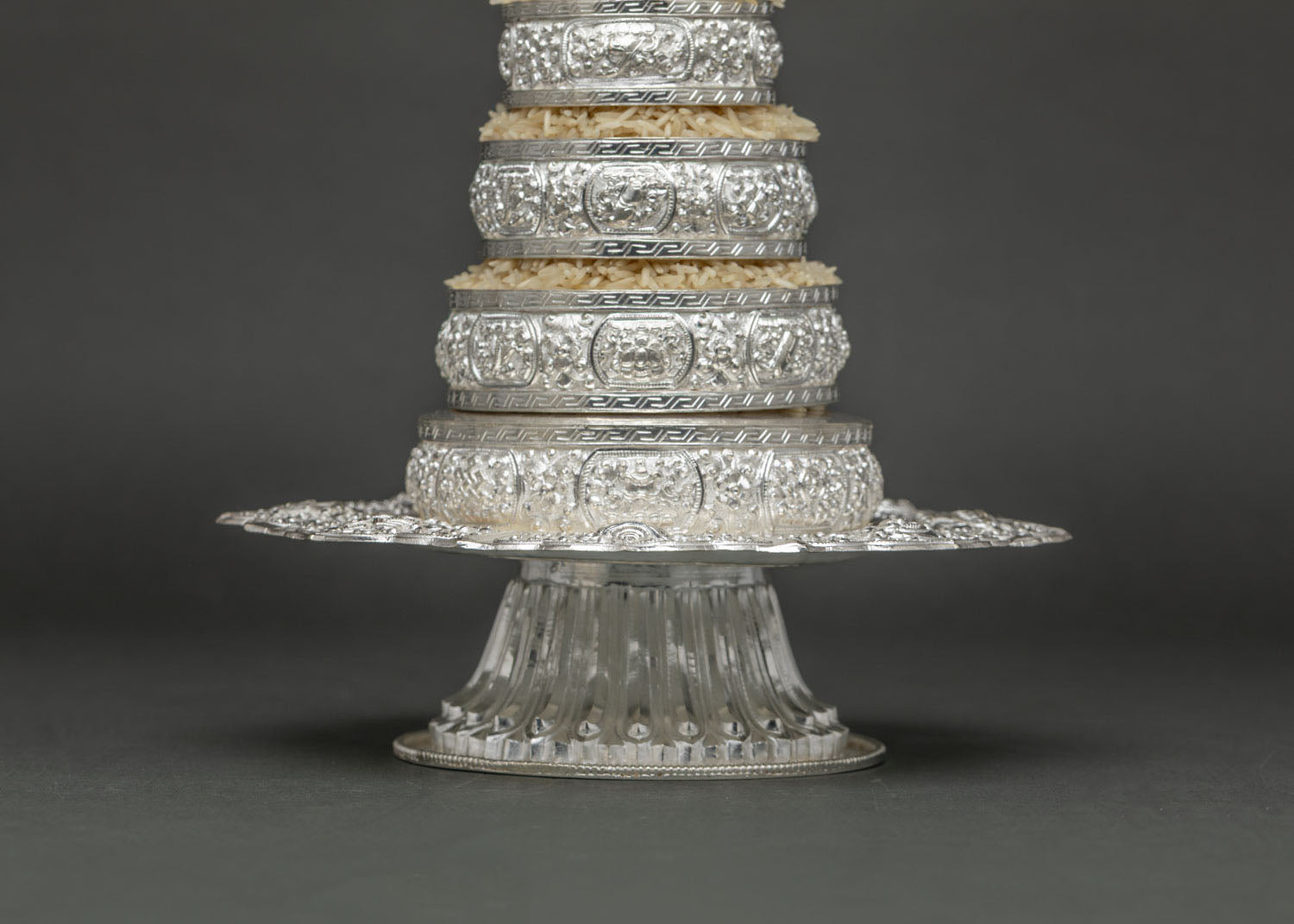Side Angle View of Silver Mandala Offering Set Showing Ornate Scalloped Base Plate and Pedestal