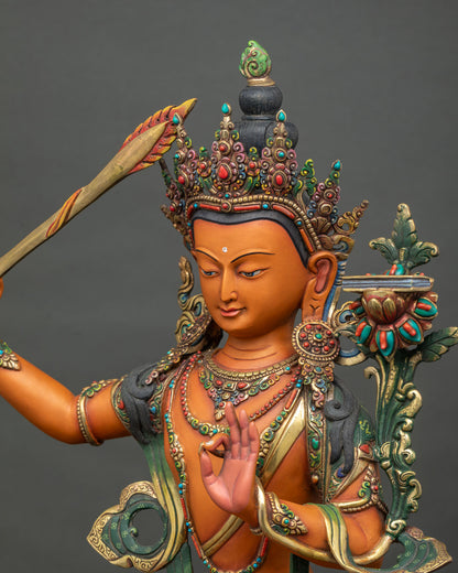 Side close-up of Manjushri Statue highlighting gold-gilded crown detail