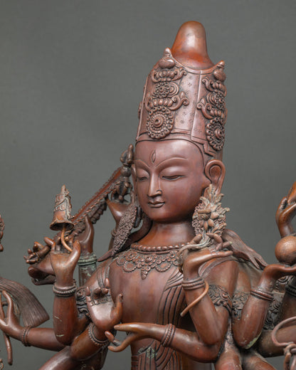 Side close-up of 18-armed Chundi statue showing hand-cast copper details and mudras