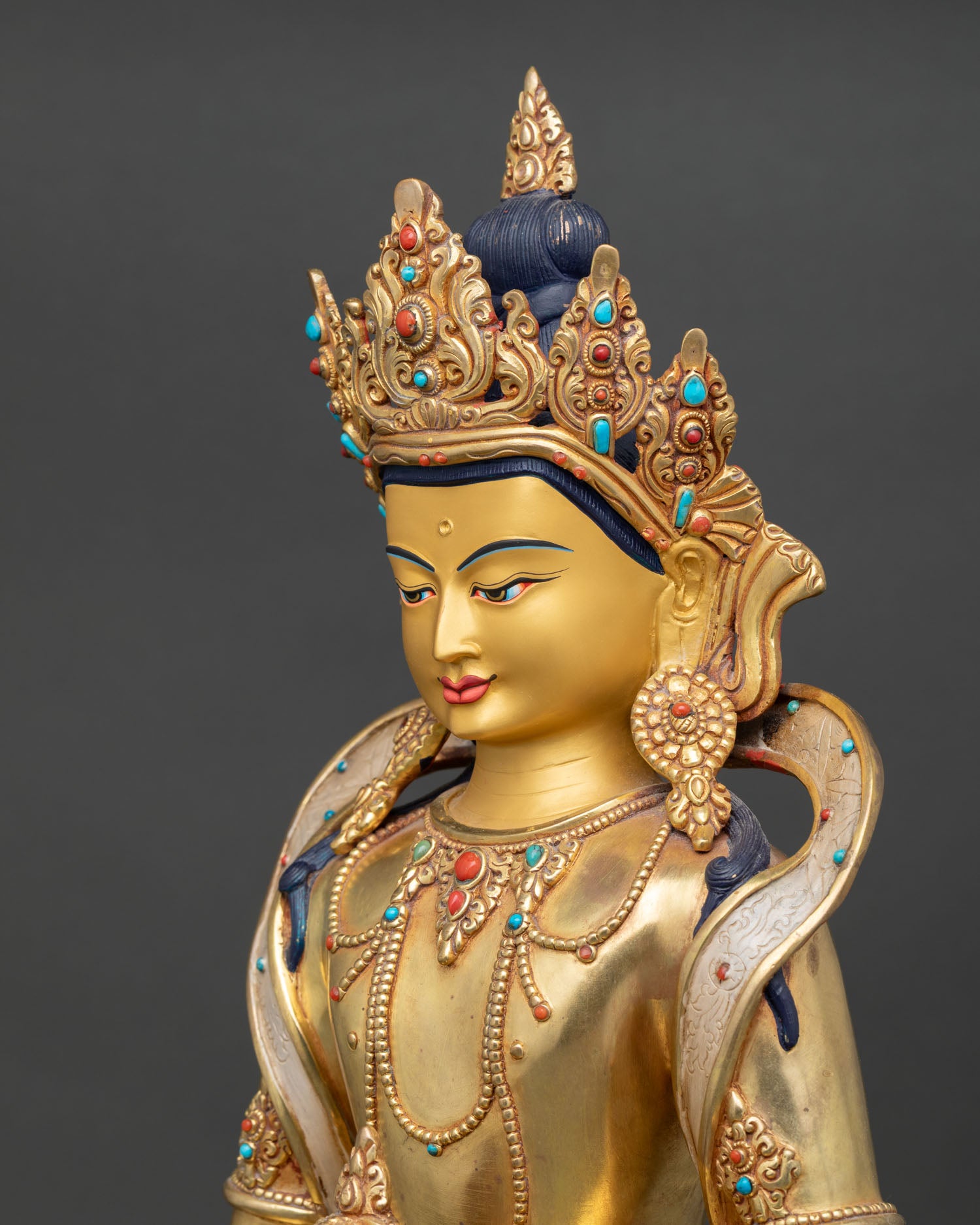 Side Close Up of Amitayus Statue with Gold Painted Face and Turquoise Halo