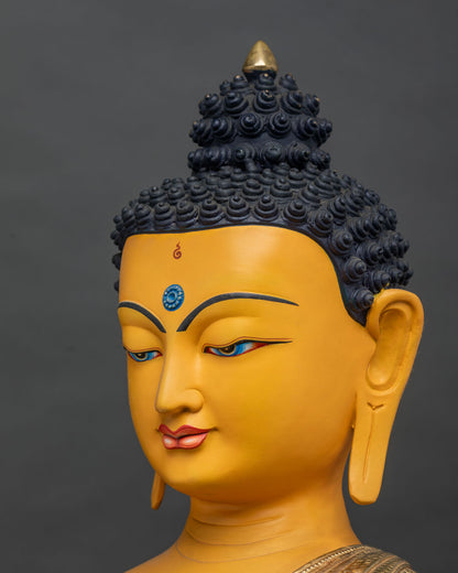 Side close-up of Buddha's face, hand-painted, downcast eyes, gold-gilded finish