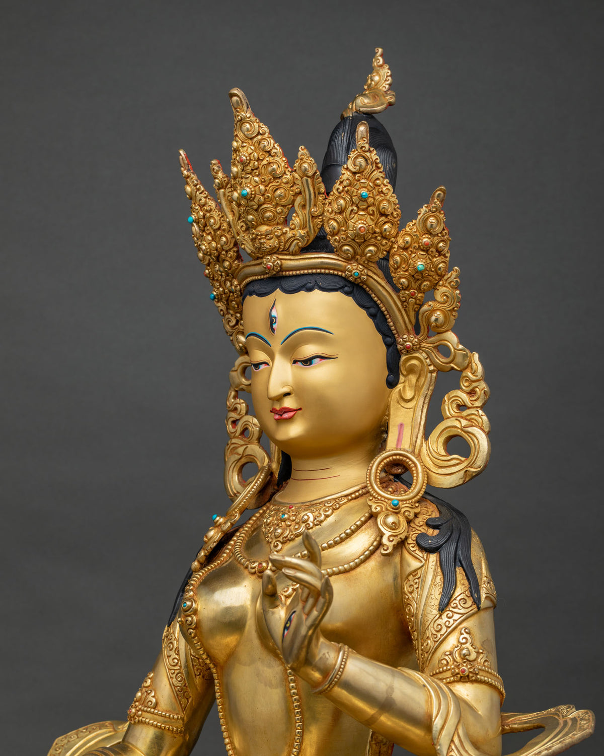 Side close up of Dukar Sitatapatra statue detailing crown and jewelry, Nepal