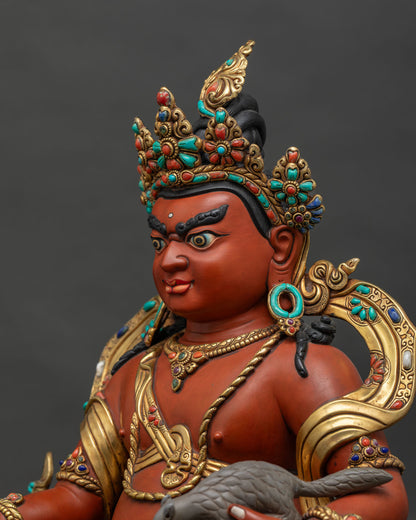 Side close-up of Dzambhala Statue showing repousse work and semi-precious stone inlay