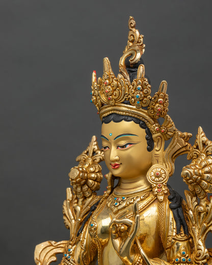 Side close-up of Green Tara statue highlighting crown, robes, and lotus pedestal