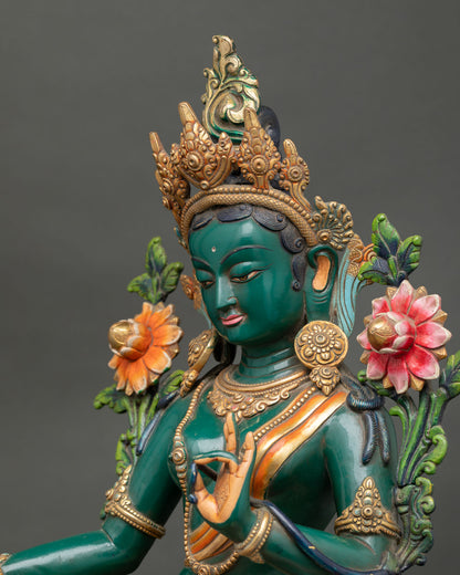Side close up of Green Tara statue highlighting ornaments, lotus throne and copper craftsmanship
