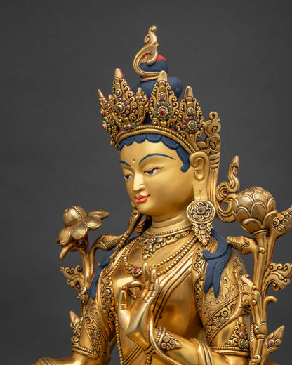 Side close-up of Green Tara statue showing crown and lotus flower detail