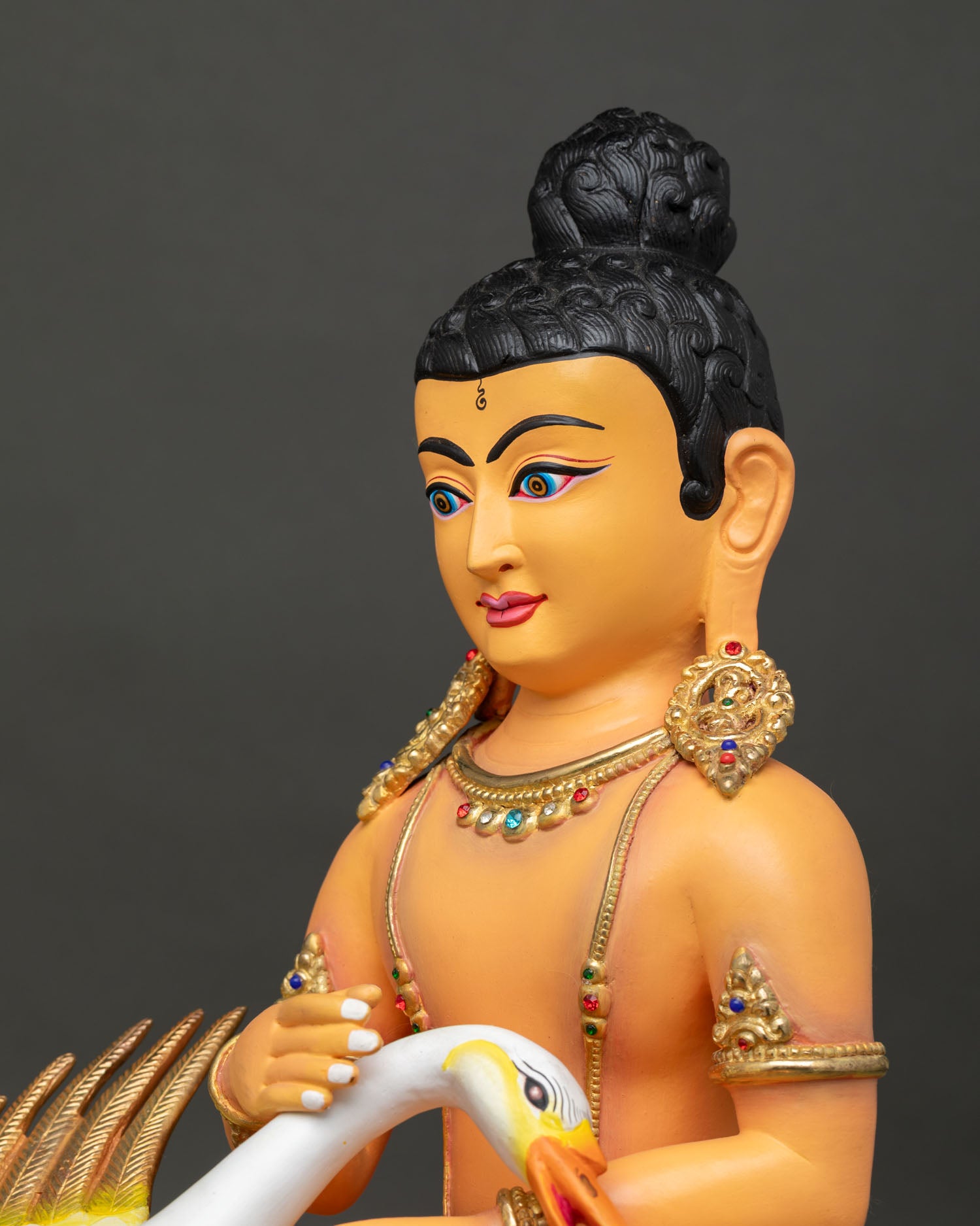 Side close-up of handcrafted Young Buddha Saving the Swan copper sculpture