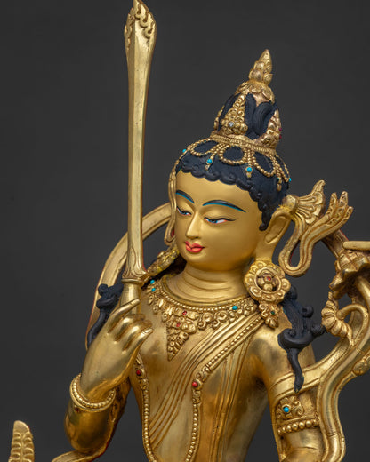Side close-up of Manjushri Statue showing gold filigree and turquoise coral details