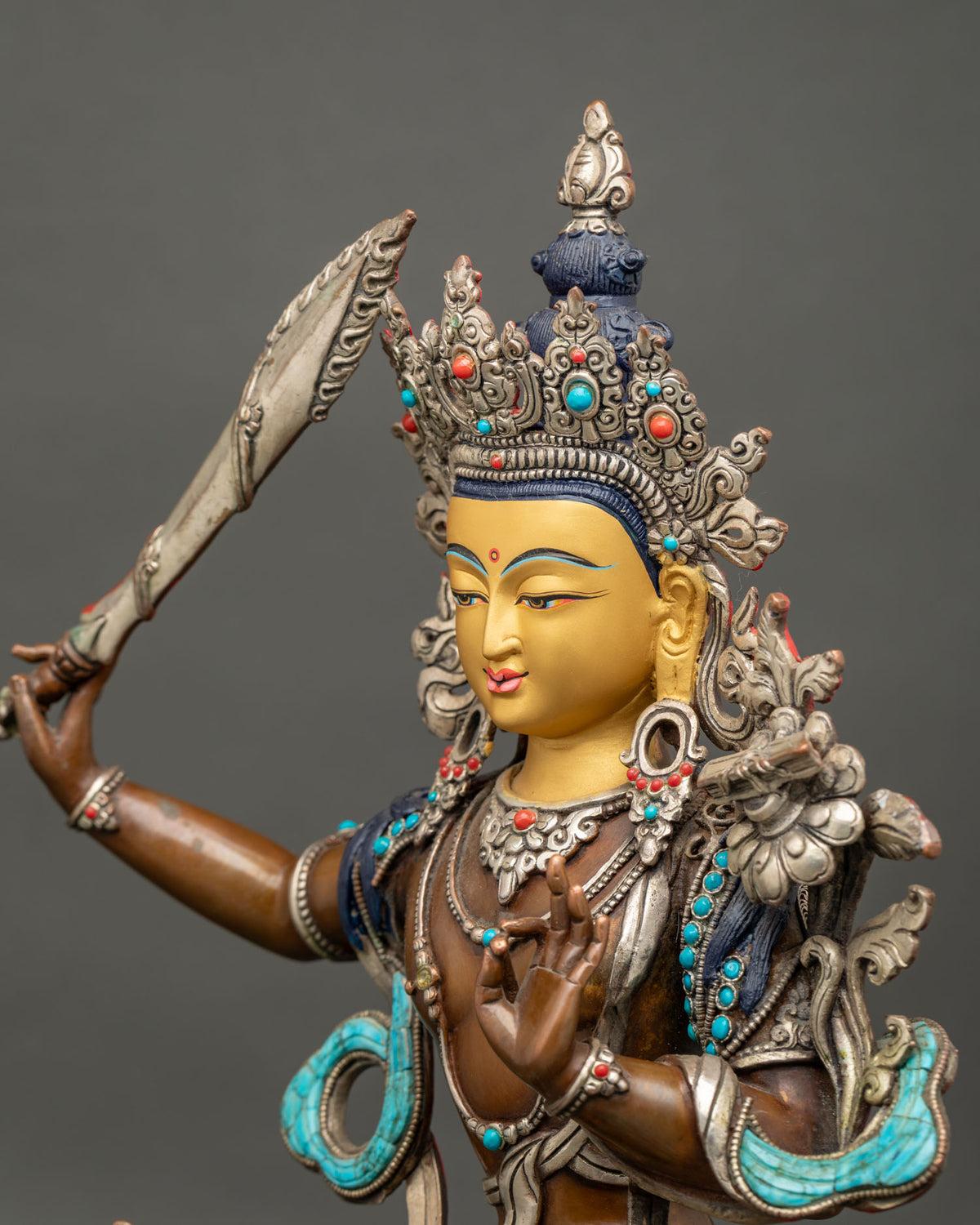 Side Close Up of Manjushri Statue Showing Silver Filigree, Turquoise and Lapis Lazuli