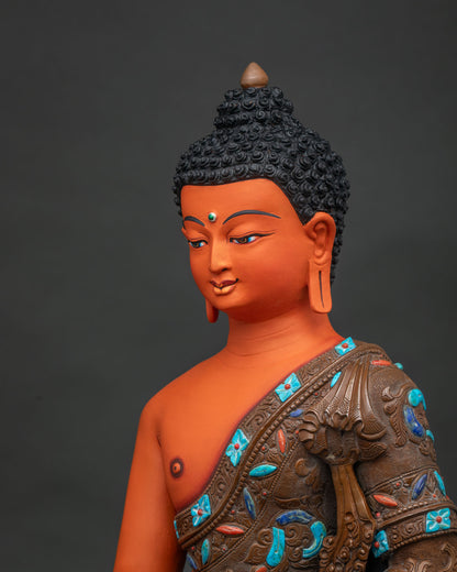 Side close-up of Shakyamuni Buddha statue highlighting oxidized copper robe carving and lotus throne