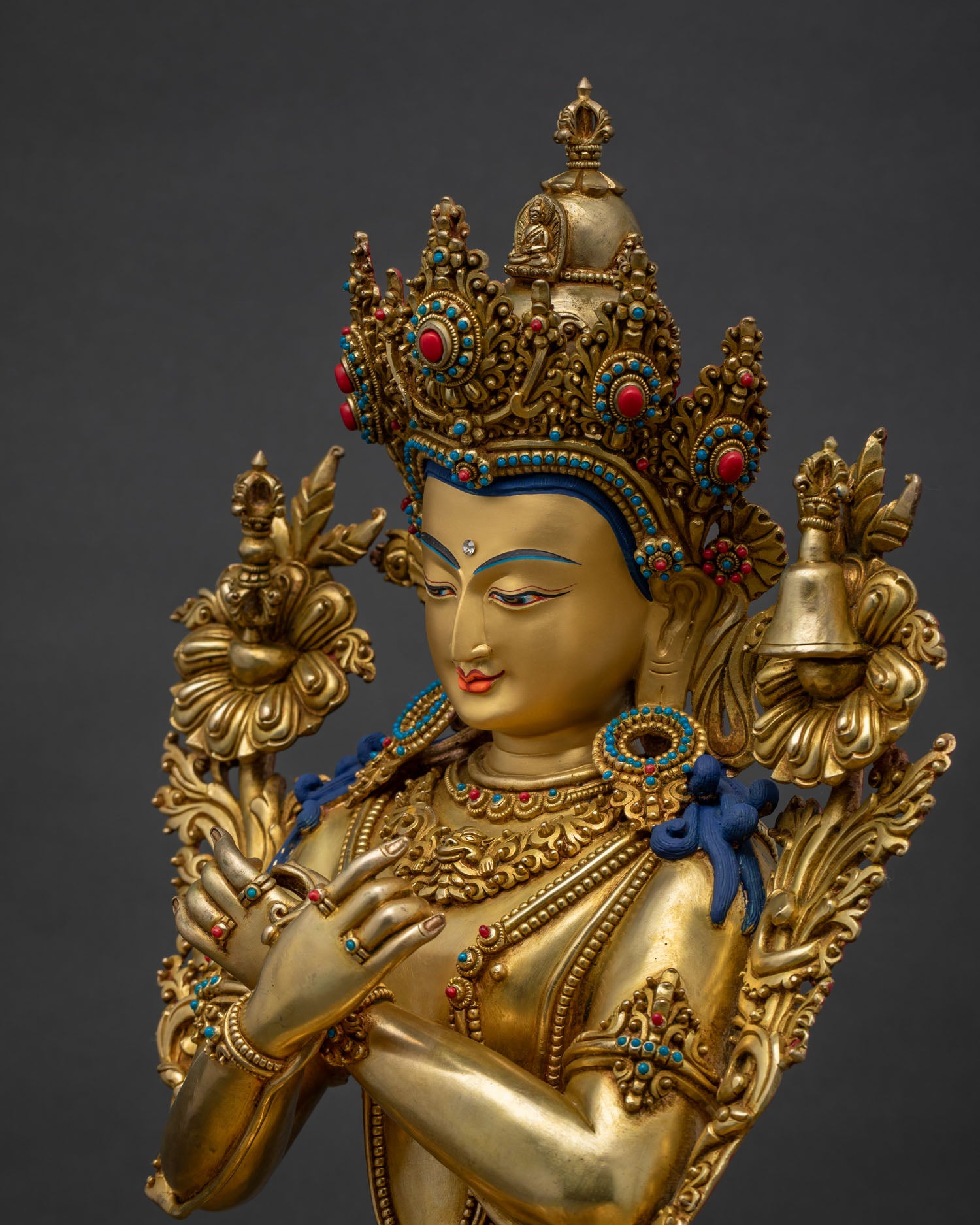 Side close-up of Vajradhara statue highlighting five-jeweled crown details