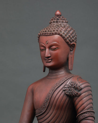 Side close up showing oxidized copper Shakyamuni Buddha robe folds and craftsmanship