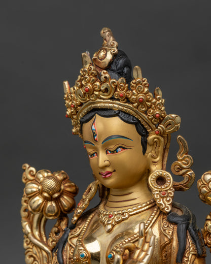Side close-up of White Tara statue, ornate lotus seat and flaming halo visible