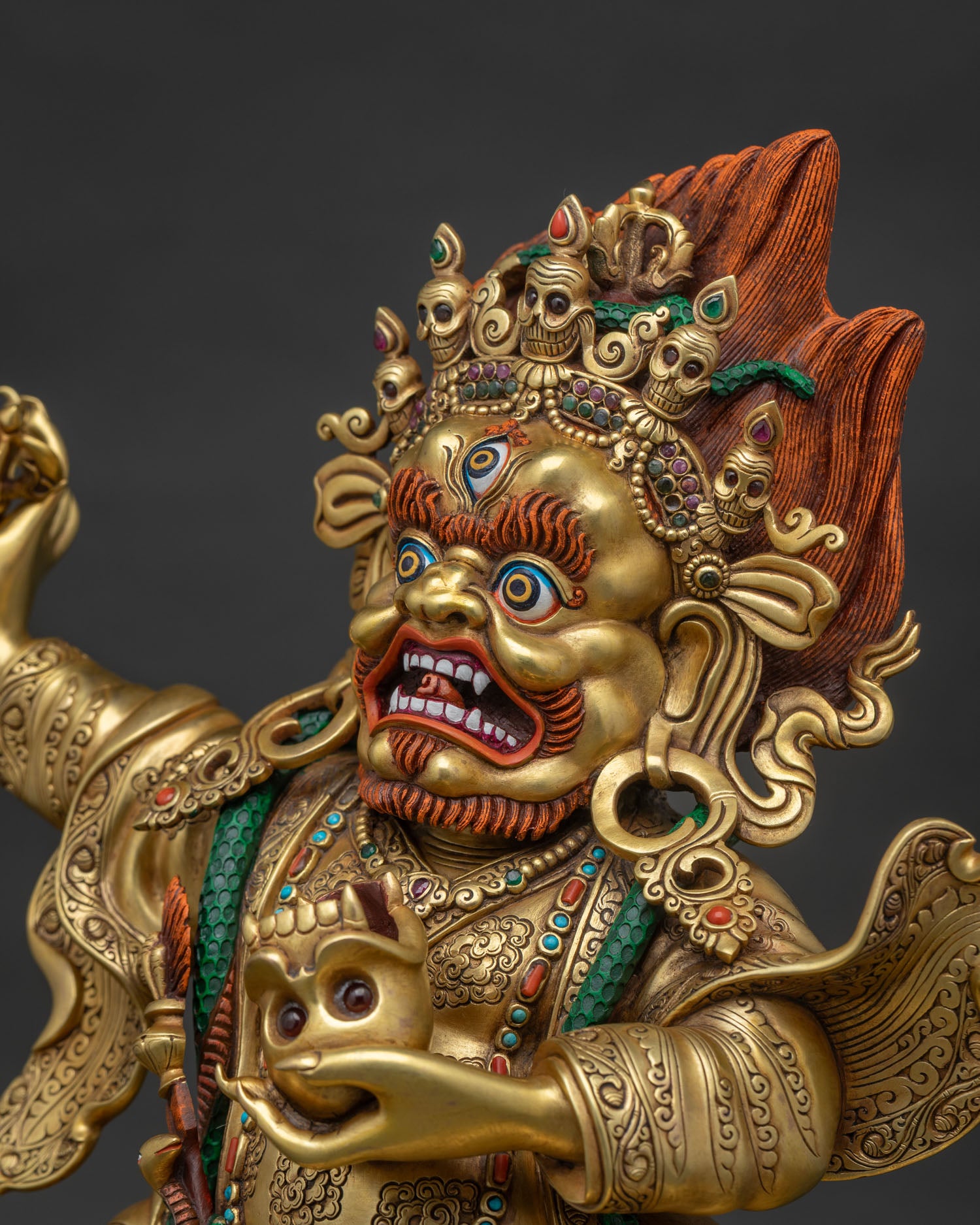 Side detail of Mahakala Bernagchen Statue with intricate jewelry and robes