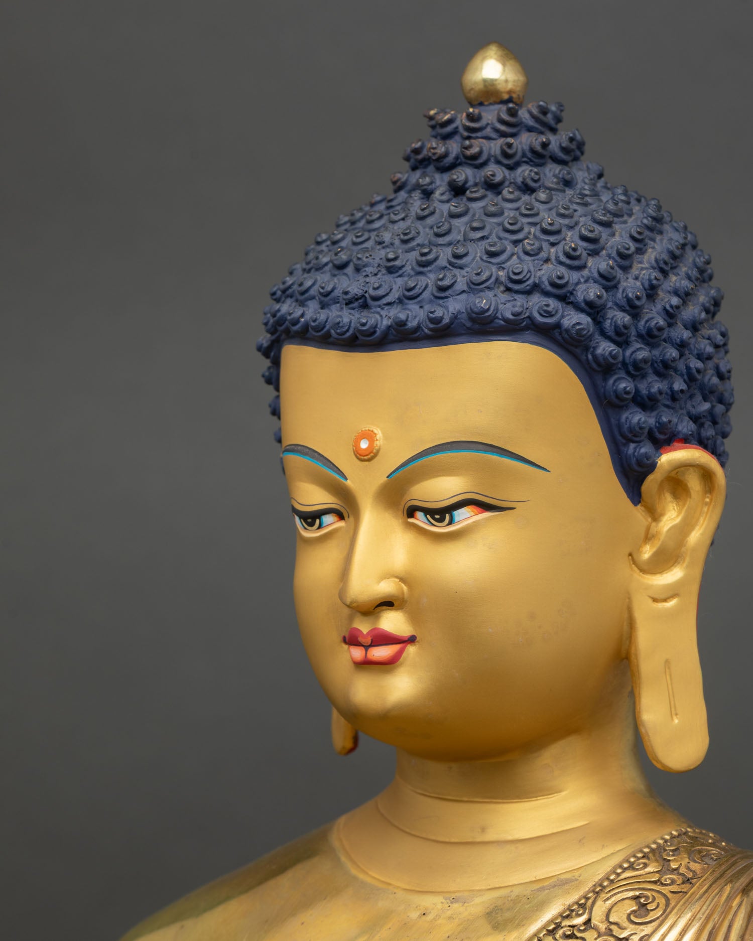 Side face close up Amitabha Buddha peaceful expression detailed gold artistry