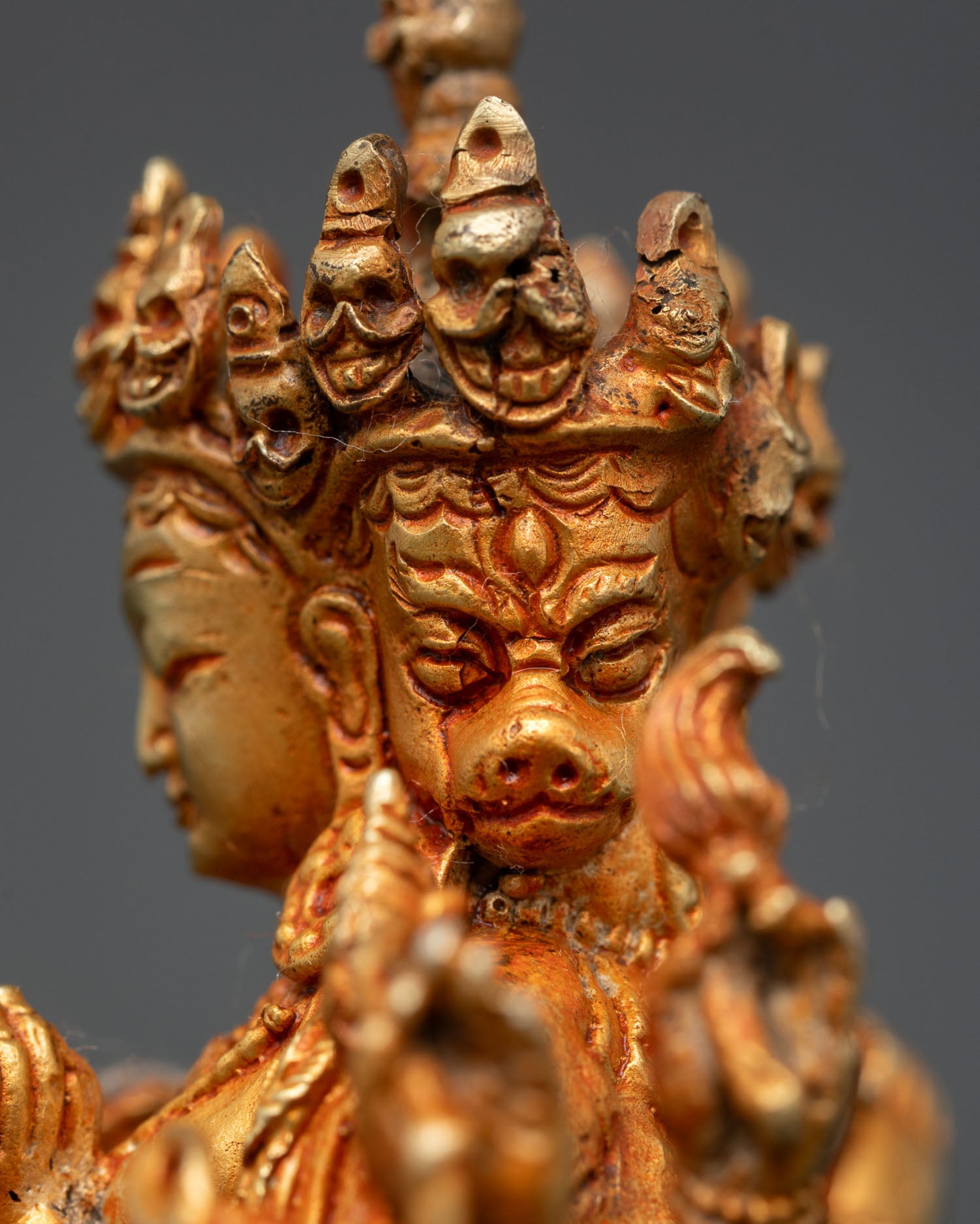side face close up marichi statue divine expression gold finish detail