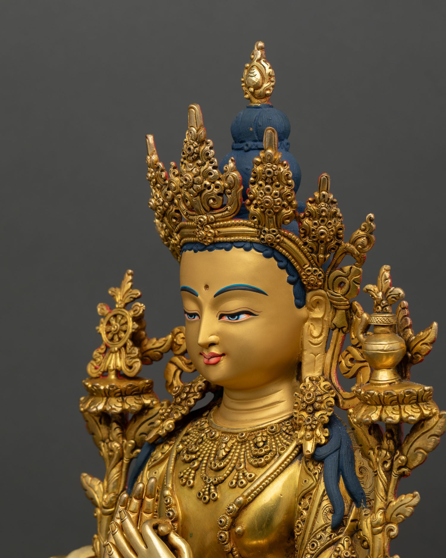 side face close up of maitreya buddha, gold painted face with calm expression