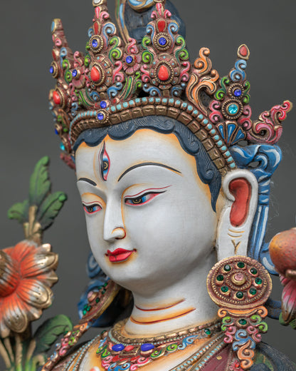 side face close up of white tara statue with seven eyes and hand painted features