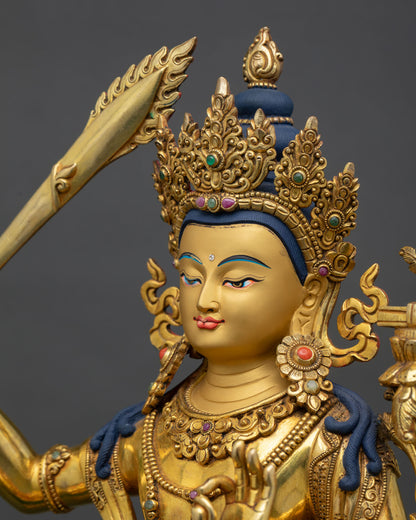 side portrait detail of manjushri face, golden features and finely carved crown elements