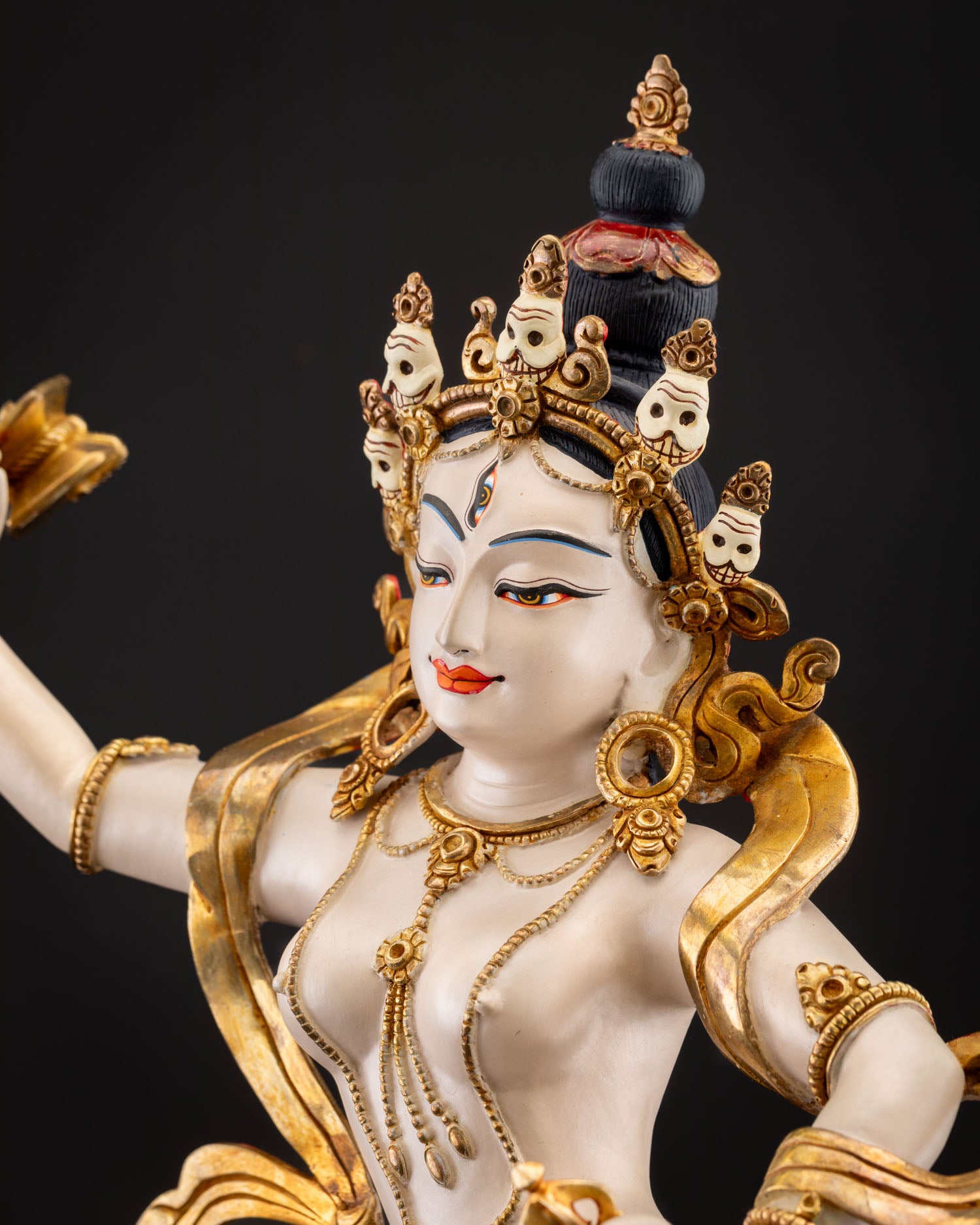 Side portrait of Machig Labdron Statue highlighting facial features and jewelry