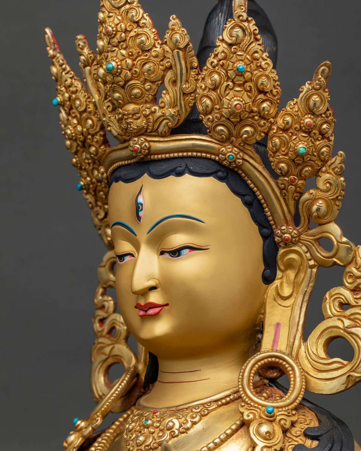Side profile close up of Dukar Sitatapatra statue's face and headdress, Nepal