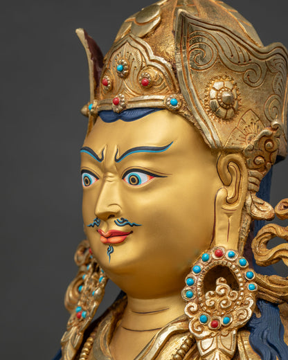 Side profile face close up of Tsokye Dorje statue with arched brows, gold face and turquoise earrings