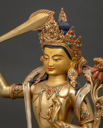 Side profile of Manjushri Statue with gold painted face and jeweled crown