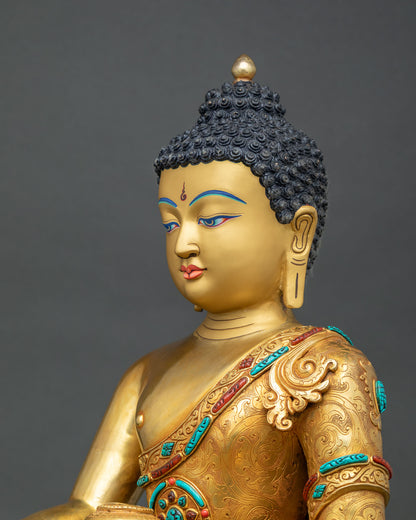 Side profile of Nepalese Shakyamuni Buddha statue with turquoise and coral stone inlay