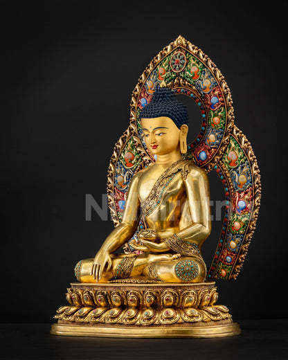 Side profile of Shakyamuni Buddha statue with ornate acrylic halo and double-lotus pedestal