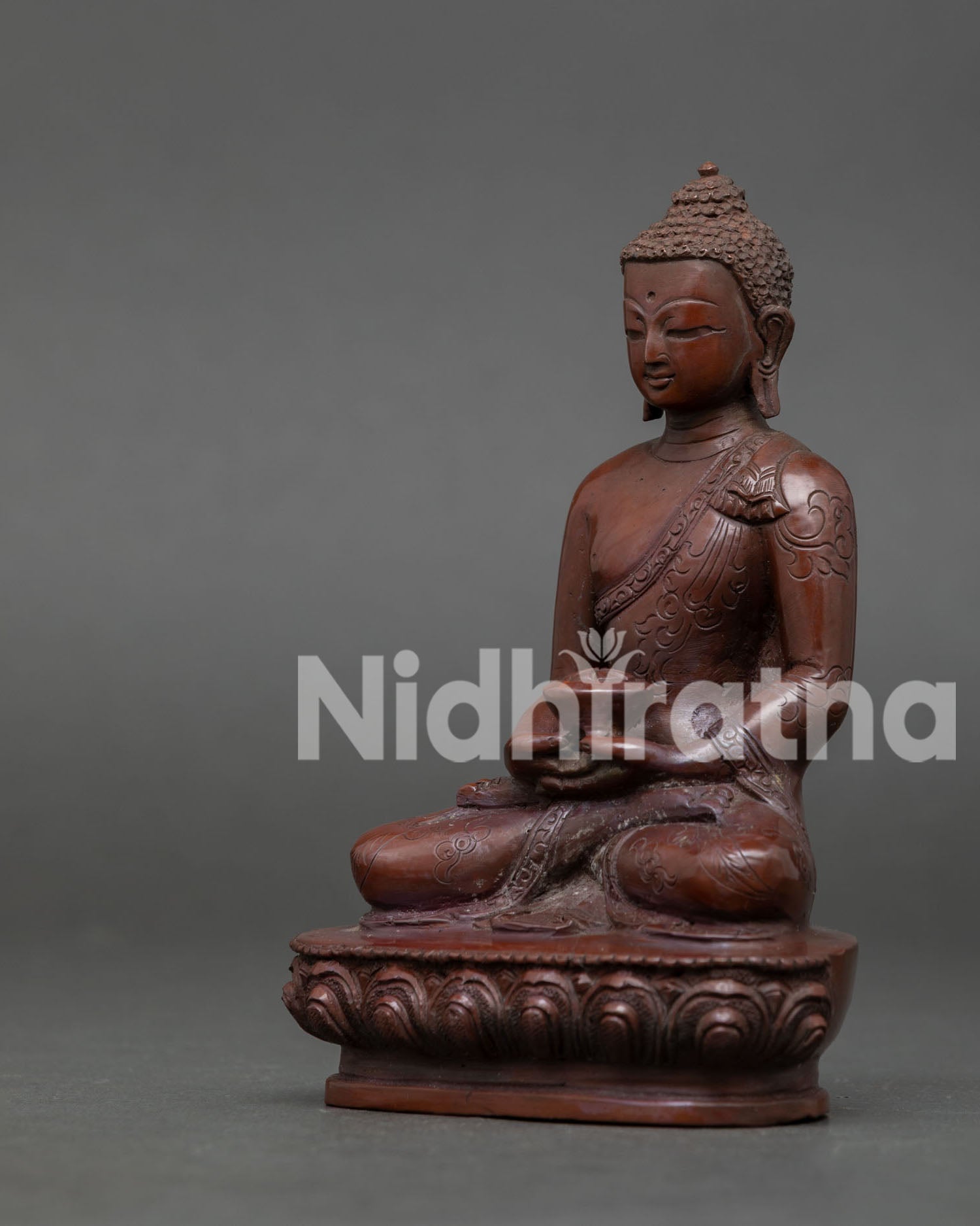 Side-View Amitabha Buddha statue made by Newari artisans Patan Nepal featuring lotus seat and sacred alms bowl.