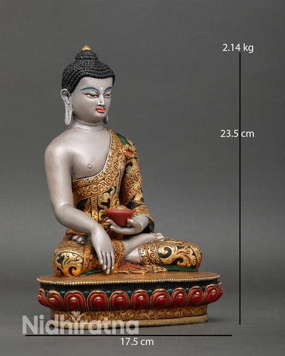 Side view of Buddha Shakyamuni seated posture holding begging bowl lotus seat symbolic compassion and monastic Buddhist art sculpture
