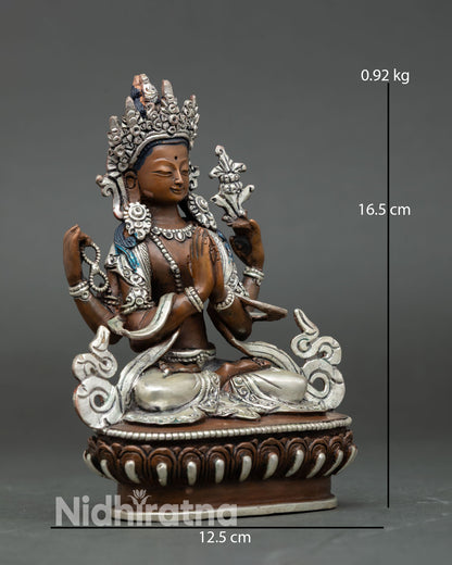 Side view of Chenrezig Bodhisattva statue, silver plated jeweled crown, flowing robes, semi precious stones, handmade Nepal copper sculpture