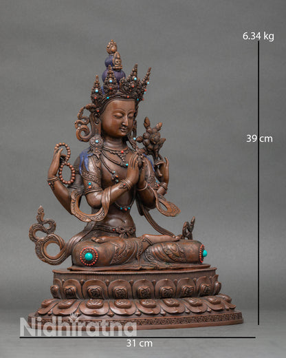 Side view of four arm Chenrezig Avalokiteshvara oxidized copper lotus seat