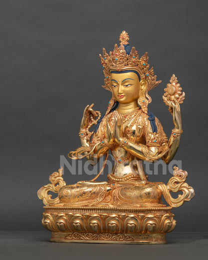 Side view Chenrezig statue with hand carved floral garment and intricate newari details.