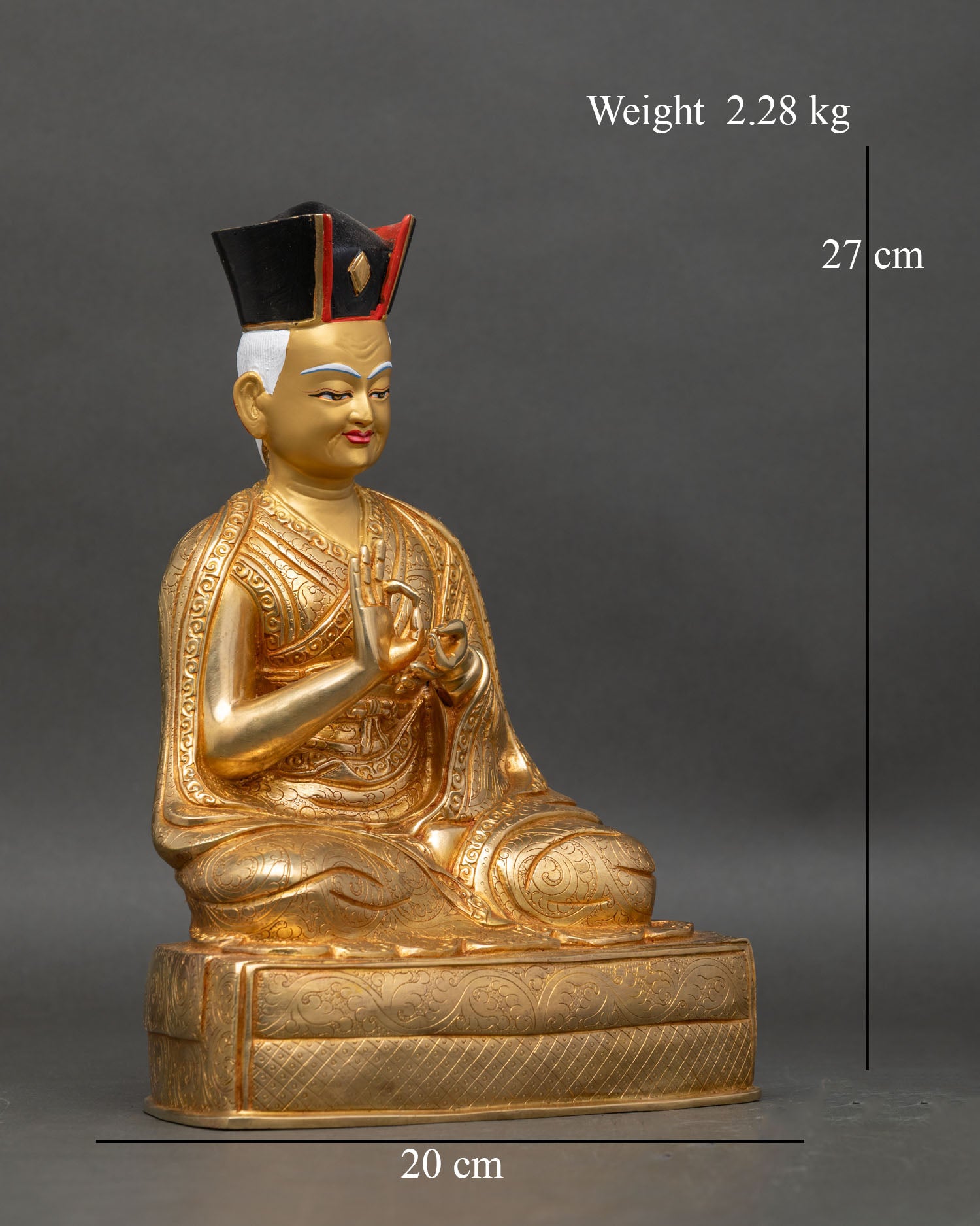 Side view of Dusum Khyenpa statue with Dharmachakra Mudra and monk robe carvings
