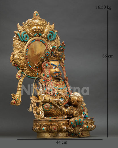Side view of Dzambhala sculpture Nepal seated prosperity deity holding nakula mongoose and citron fruit gold gilded copper finish